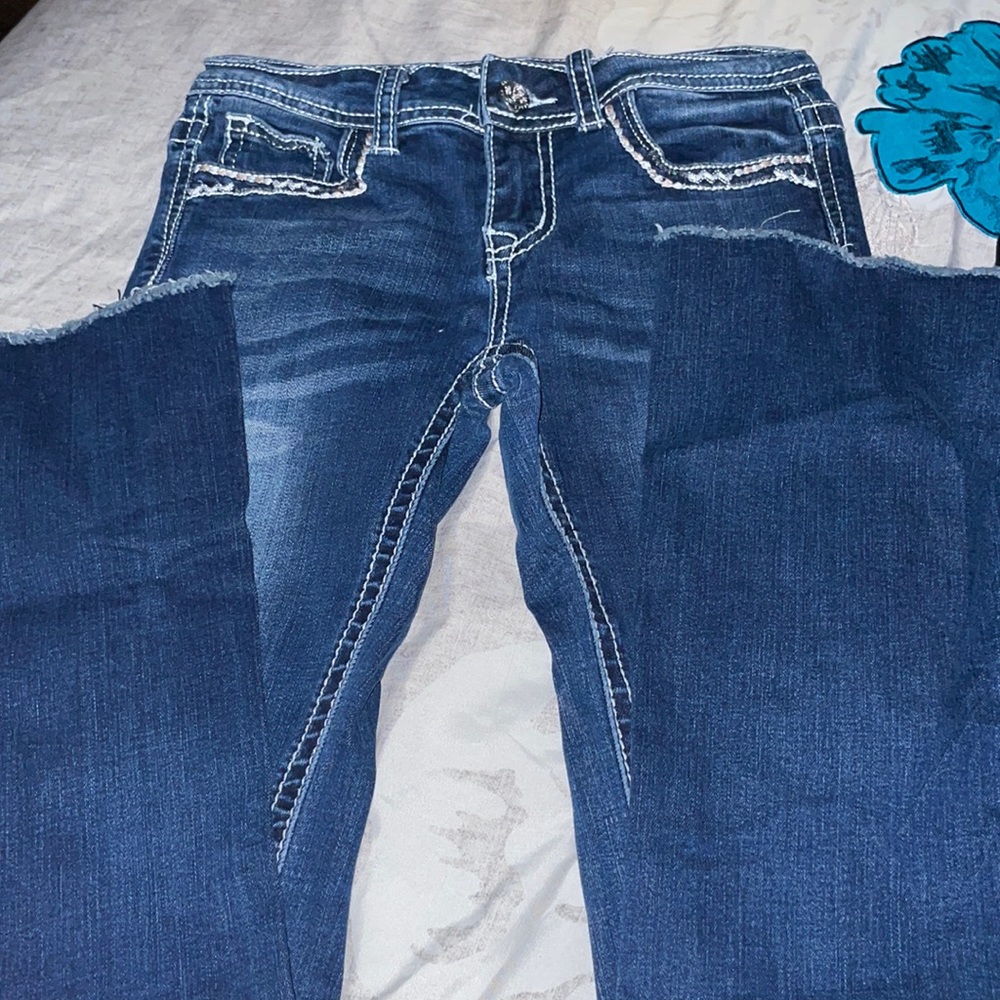 Girls bootcut jeans with design on back pockets
